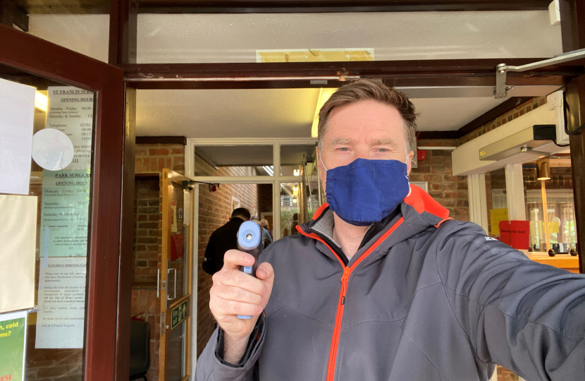 Pictured; Steve with the temperature gun at the entrance to Park Surgery