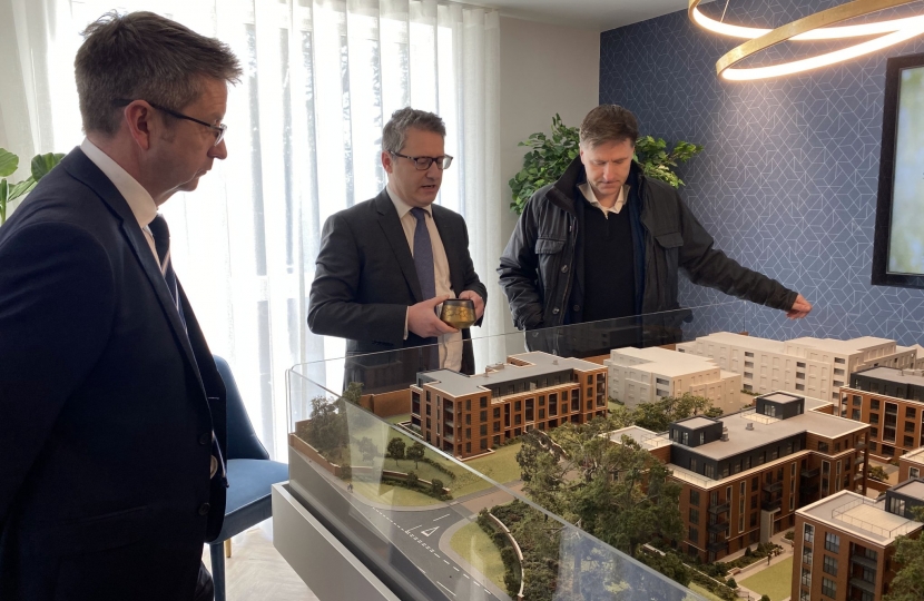 Steve Brine MP with Mark Washer overlooking model of houses