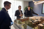 Steve Brine MP with Mark Washer overlooking model of houses