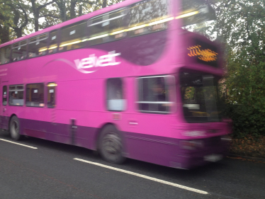 Purple bus moving