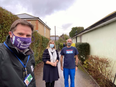 Pictured; Steve Brine with members of the team