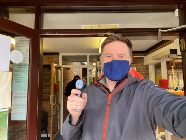 Pictured; Steve with the temperature gun at the entrance to Park Surgery