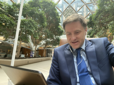 Steve Brine in the Atrium at Portcullis House enjoying the event with members of the Christ Church community.