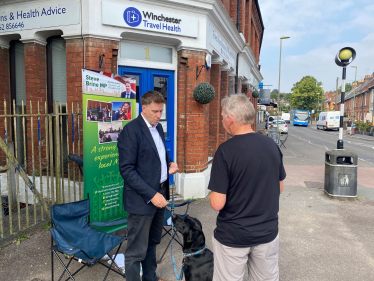 Steve Brine talking to a resident at his Summer tour street surgery