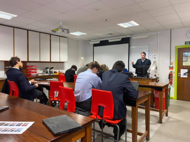 Pictured; Steve Brine teaching a class of students