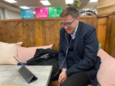 Pictured; Steve Brine connecting to Zoom in the Open House Deli