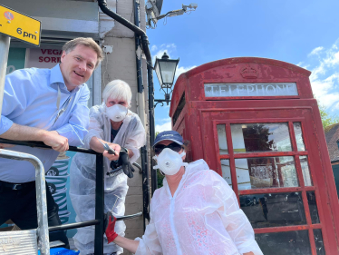Pictured; Steve Brine MP with Councillor Sue Cook and Dr Ingrid Percival in front of the Twyford Crossroads telephone box.